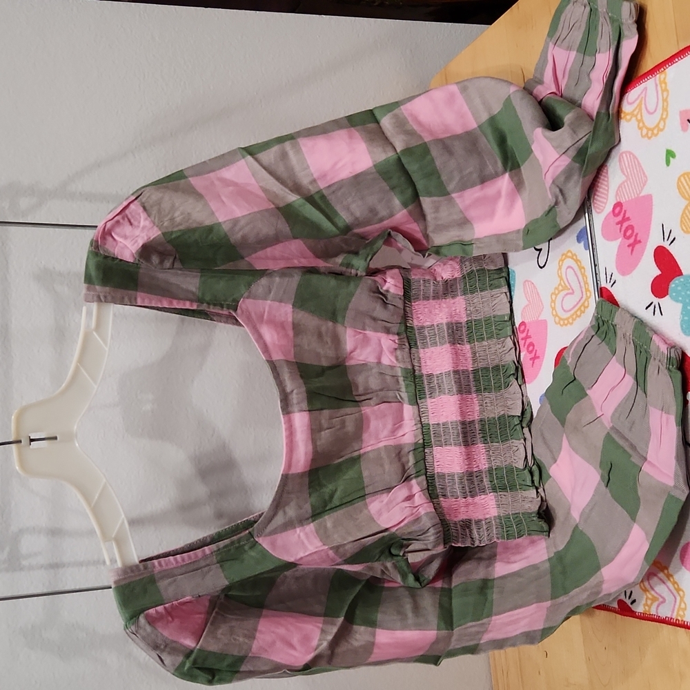 Pink and green plaid crop top with long sleeves.